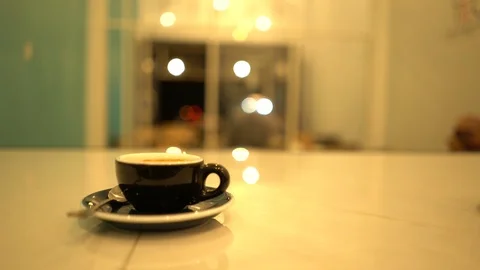 A cup of coffee with blurred background in the night Stock Footage 125927526