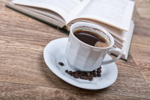 A cup of coffee with a book Stock Photos