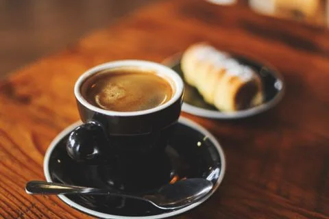 Cup of coffee with bread Stock Photos
