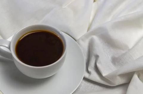 A cup of coffee breakfast in bed close-up Stock Photos