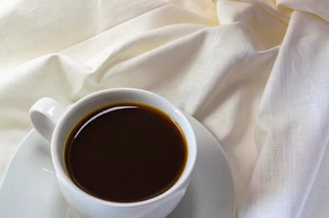 A cup of coffee breakfast in bed Foto stock