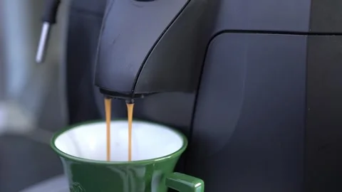 A cup of coffee is brewed in the coffee machine. Stock Footage 309190301