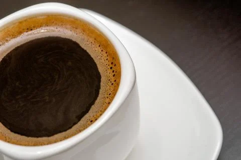 Cup of coffee on a brown background 写真素材
