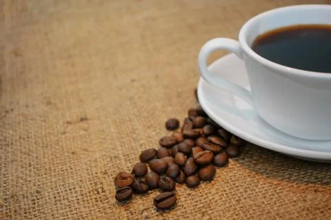 Cup of coffee on a burlap background Stock Photos