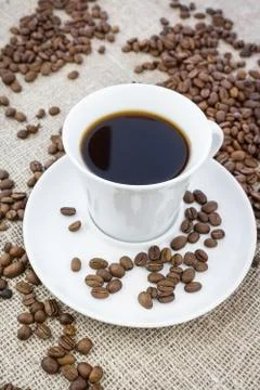 Cup of coffee in burlap Stock Photos