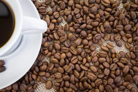Cup of coffee in burlap Stock Photos