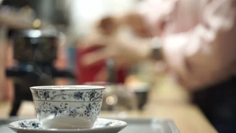 A cup of coffee in a cafe with the blurry background Stock Footage 261248407