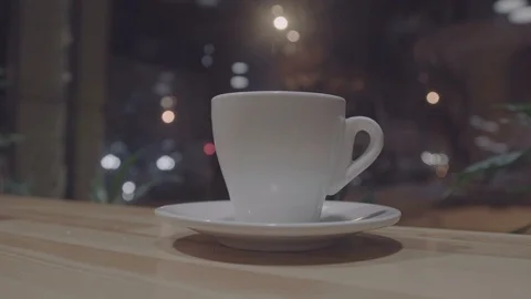 Cup of coffee in cafe. with blurry background(and bokeh) at night time 스톡 동영상 86294727