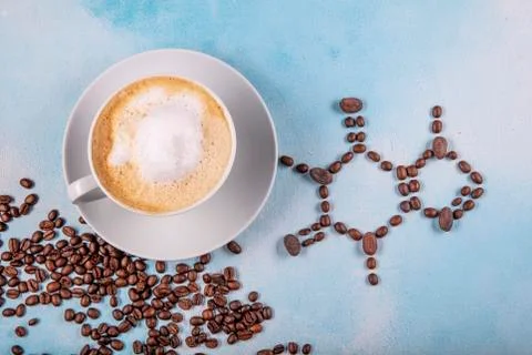 A cup of coffee with caffeine molecule created by coffee beans. Foto stock