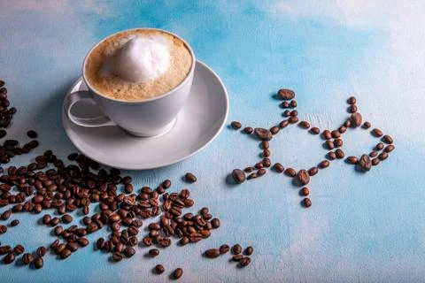 A cup of coffee with caffeine molecule created by coffee beans. Stock Photos