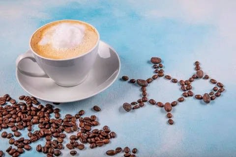 A cup of coffee with caffeine molecule created by coffee beans. Stock Photos
