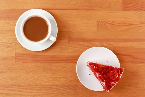 A cup of coffee with cake, an invigorating drink in the morning, home comfort. Stock Photos