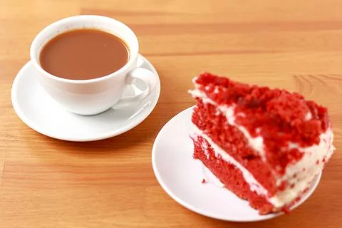 A cup of coffee with cake, an invigorating drink in the morning, home comfort. Stock Photos