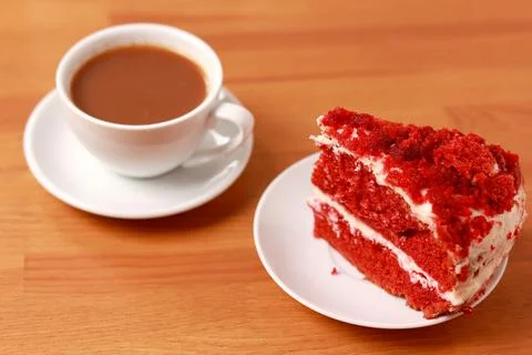A cup of coffee with cake, an invigorating drink in the morning, home comfort. Stock Photos