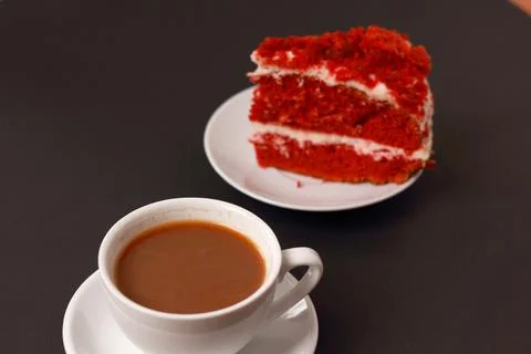 A cup of coffee with cake, an invigorating drink in the morning, home comfort. Stock Photos