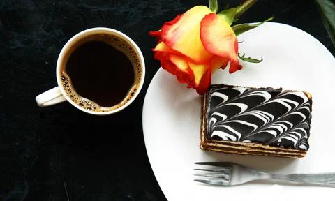 A cup of coffee with a cake Photos