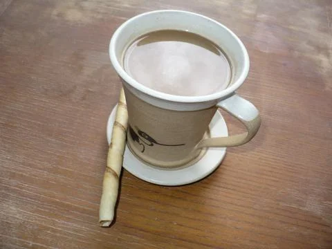 Cup of coffee with candy bar Stock Photos