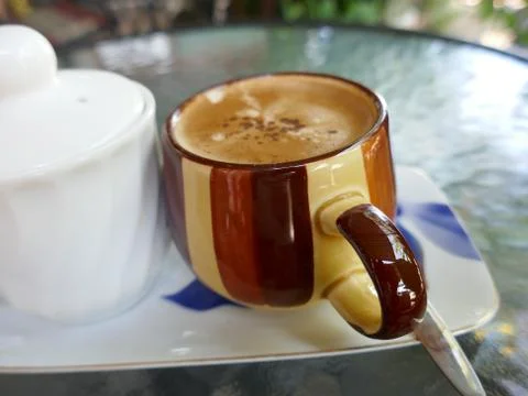 Cup of coffee with cappuccino on table Stock Photos