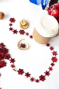 Cup of coffee with christmas decor on a table. Stock Photos