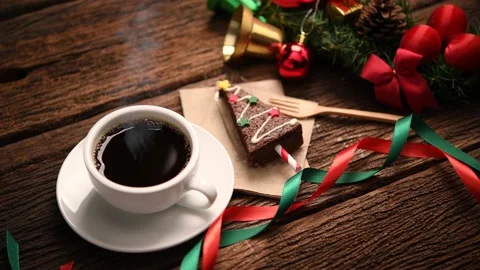 Cup of coffee with christmas decorations on old wooden table Видео 143244022