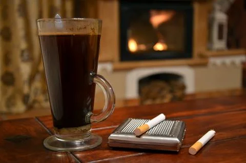 Cup of coffee, cigarette and snuffbox Stock Photos
