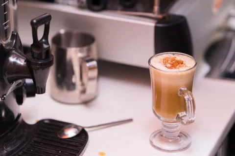 Cup of coffee with cinnamon on the table Stock Photos