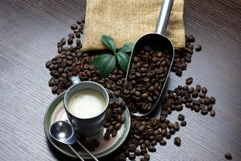 A cup of coffee with coffee bean as background 写真素材