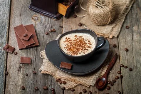 Cup of coffee with coffee beans and chocolate Stock Photos