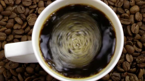 Cup of Coffee on Coffee Beans Stock Footage 66520607