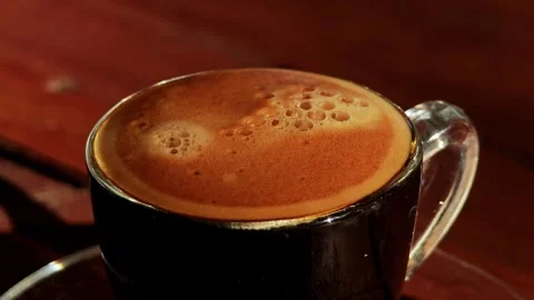 Cup of coffee on the coffee beans. Stock Footage 306924427