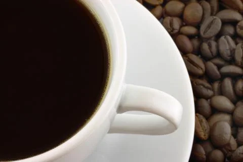 Cup of coffee with coffee beans Stock Photos