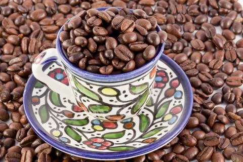 Cup of coffee on coffee beans Stock Photos