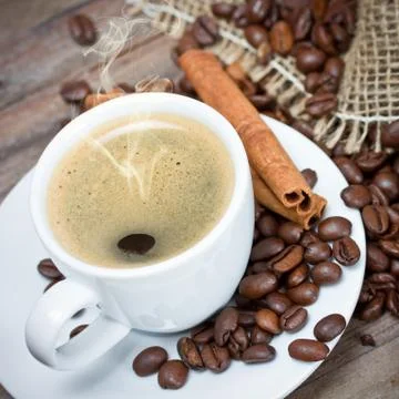 Cup of coffee with coffee beans Stock Photos