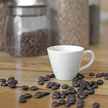Cup of coffee with coffee beans Stock Photos