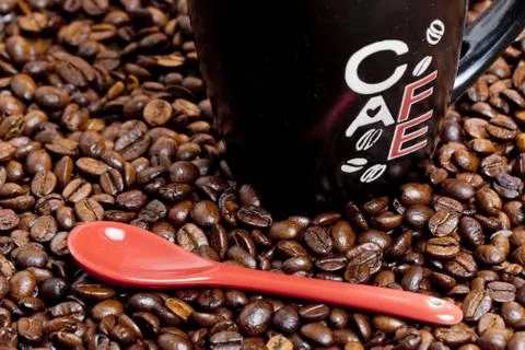 Cup of coffee with coffee beans Stock Photos