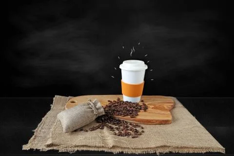Cup of coffee with coffee beans Stock Photos