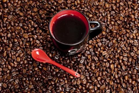 Cup of coffee with coffee beans Stock Photos