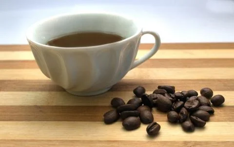 A cup of coffee, coffee beans Stock Photos