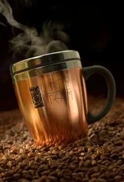 Cup of Coffee with Coffee Beans Stock Photos
