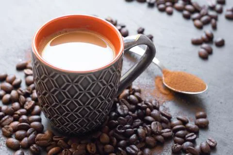 Cup of coffee with coffee beans Stock Photos