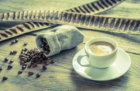 Cup of coffee with coffee beans Stock Photos