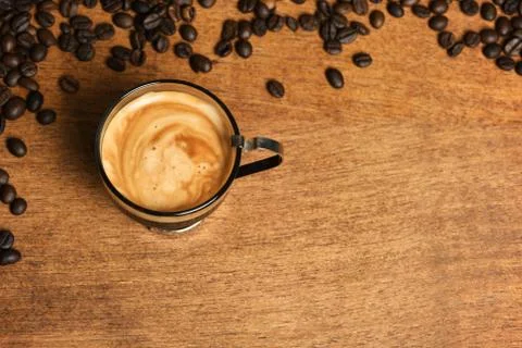 Cup of coffee with coffee beans Stock Photos