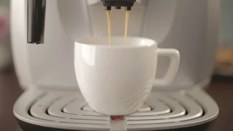 A cup of coffee in a coffee machine Stock Footage 77827810