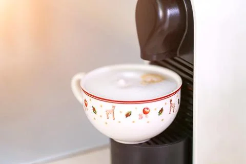 A cup of coffee in a coffee machine Stock Photos