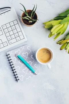 Cup of coffee, with communication device with and writing tools. Flat lay home Stock Photos