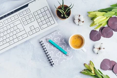 Cup of coffee, with communication device with and writing tools. Flat lay home Stock Photos