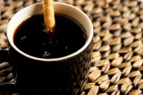 Cup of coffee with cookie stick Stock Photos