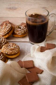 Cup of Coffee with a Cookie. Vertical image. Stock Photos
