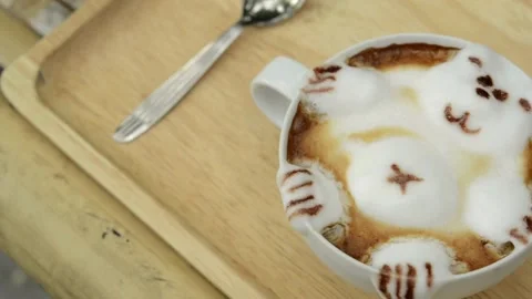 A cup of coffee with cute animal shape latte art, perfect for breakfast time. 動画素材 334648689