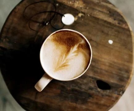 A cup of coffee on desk Stock Photos
